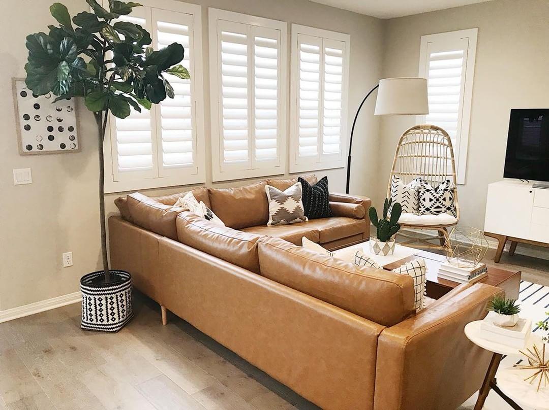 Warm living room with Polywood shutters in Boise.